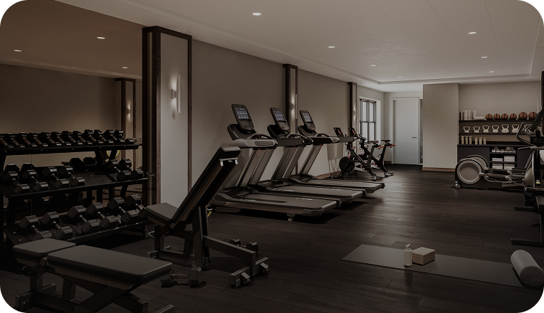 Image of benches, dumbbells, and other excercise equipment in a gym